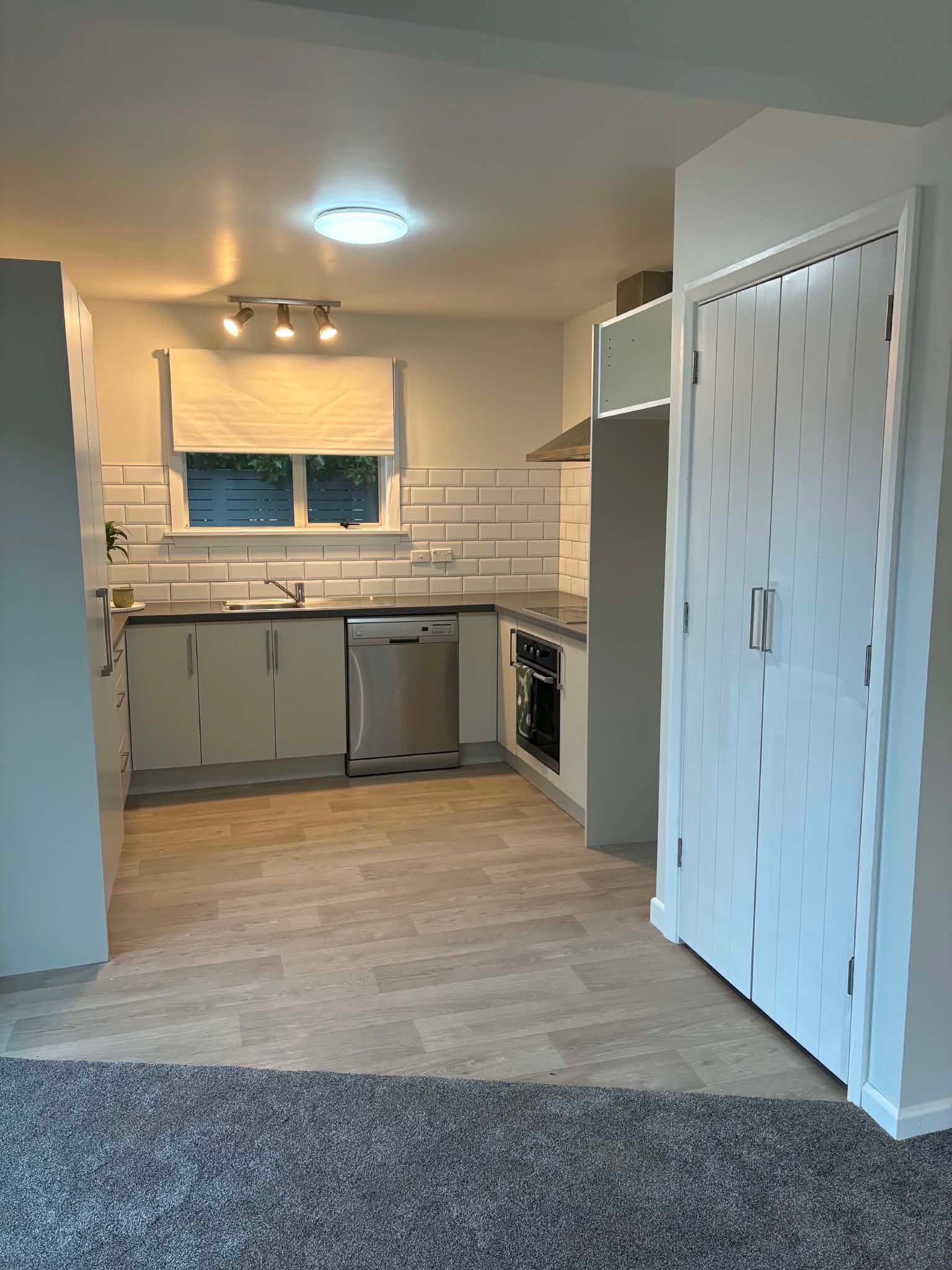 Full kitchen renovation grey cabinets subway tile splashback